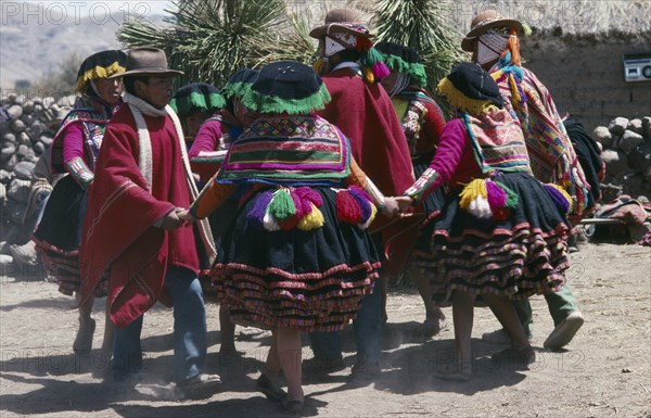 Peru, Cusco, Vilcanota Mountains, Tinqui. Villagers in traditional costume dancing during wedding celebrations. Photo : Eric Lawrie