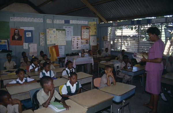 West Indies, Jamaica, Falmouth, First Grade pupils in classroom with female teacher. Photo : Nancy Durrell McKenna