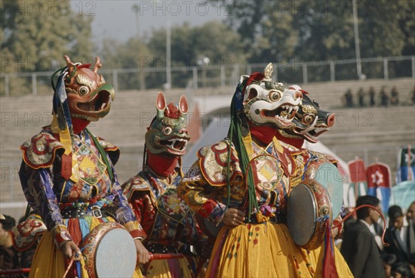 Bhutan, Festivals, Bhutanese masked dancers. Photo : Hutchison