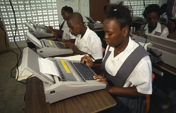 St Lucia, Education, Students in typing class using electric typewriters at desks. Photo : Liba Taylor