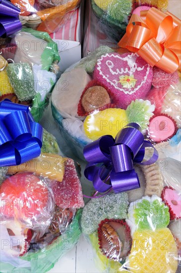 Mexico, Puebla, Colourful sweets wrapped and tied with brightly coloured ribbon. Photo : Nick Bonetti