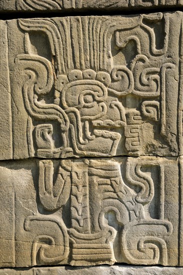 Mexico, Veracruz, Papantla, Relief carving of Mesoamerican god Quetzalcoatl the fethered serpent on wall of Juegos de Pelota Sur at El Tajin archaeological site. Photo : Nick Bonetti