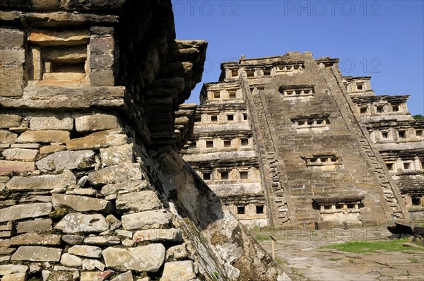 Mexico, Veracruz, Papantla, El Tajin archaeological site Corner of Monument 5 pyramid with Pyramide de los Nichos part seen behind. Photo : Nick Bonetti