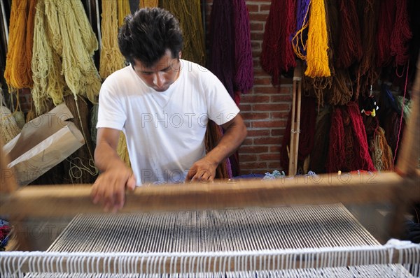 Mexico, Oaxaca, Teotitlan del Valle , Weaver at loom.. Photo : Nick Bonetti