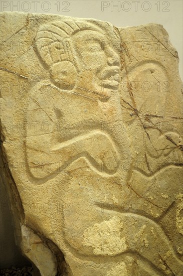 Mexico, Oaxaca, Monte Alban, Detail of relief carving depicting a dancer. Photo : Nick Bonetti