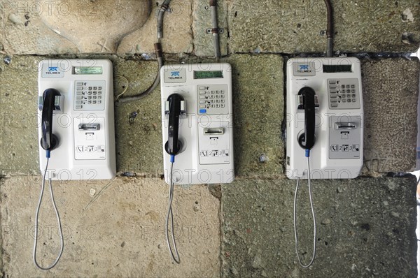 Mexico, Oaxaca, Public telephones on wall. Photo : Nick Bonetti