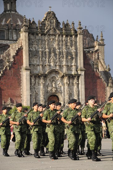 Mexico, Federal District, Mexico City, Military parade of the flag lowering ceremony in the Zocalo with the Cathedral behind. Photo : Nick Bonetti