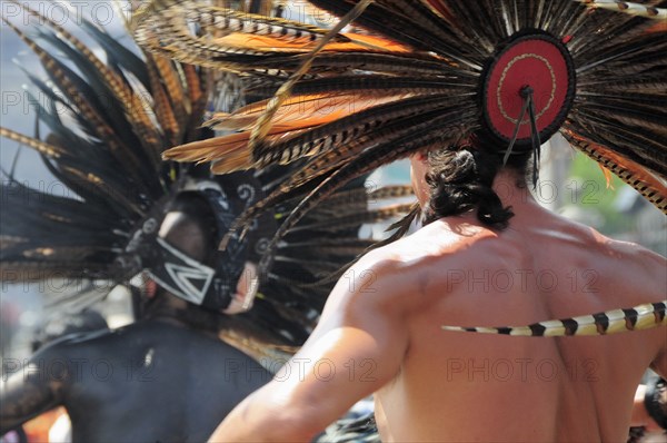 Mexico, Federal District, Mexico City, Michicoa Aztec dancers performing in the Zocalo. Photo : Nick Bonetti