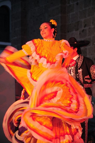 Mexico, Jalisco, Guadalajara, Plaza Tapatia Folk dancer from Jalisco State dancing at carnival.. Photo : Nick Bonetti