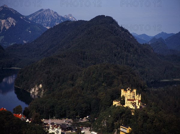 Germany, Bayern, Schwangau, View looking down on town overlooked by Schloss Hohenschwangau and Alpsee. Photo : Bryan Pickering