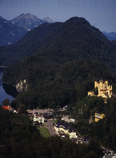 Germany, Bayern, Schwangau, View looking down on town overlooked by Schloss Hohenschwangau and Alpsee. Photo : Bryan Pickering