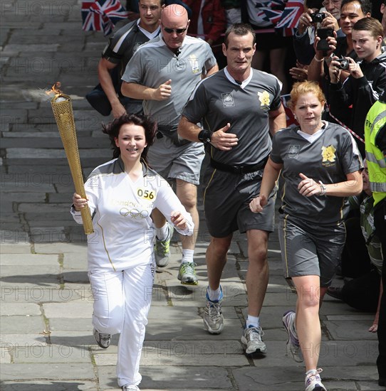 England, Kent, Tunbridge Wells, Olympic Torch relay running through the Pantiles. Photo : Sean Aidan