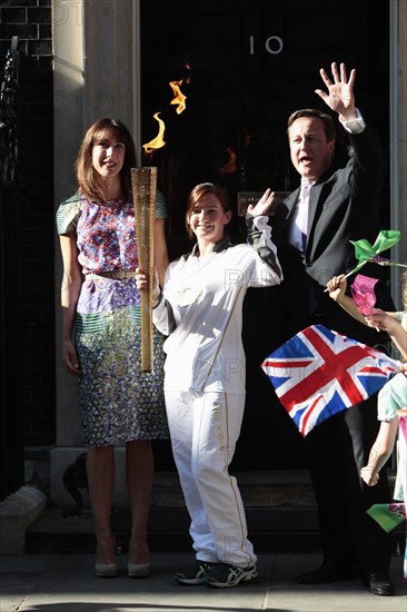 England, London, Olympic Torch relay in Downing Street Samantha and Prime Minister David Cameron welcome the torch. Photo : Sean Aidan