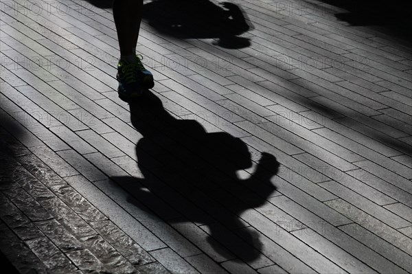 England, London, Southwark Shadows of commuters. Photo : Sean Aidan