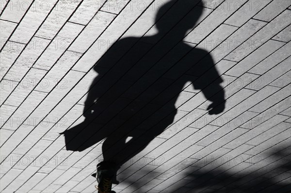 England, London, Southwark Shadows of commuters. Photo : Sean Aidan