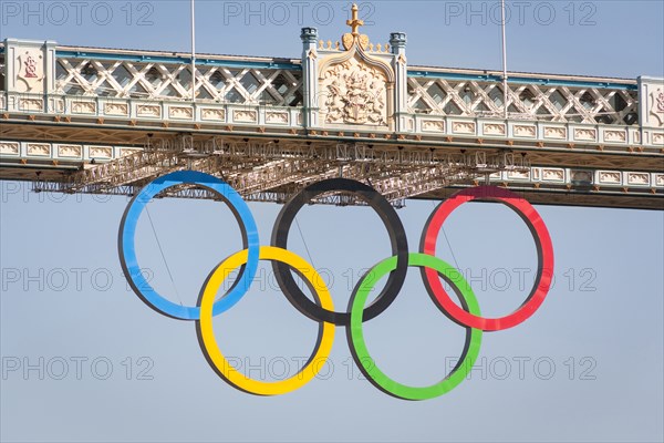 The Olympic rings, celebrating the 2012 Olympic Games, suspended from Tower Bridge, London, England