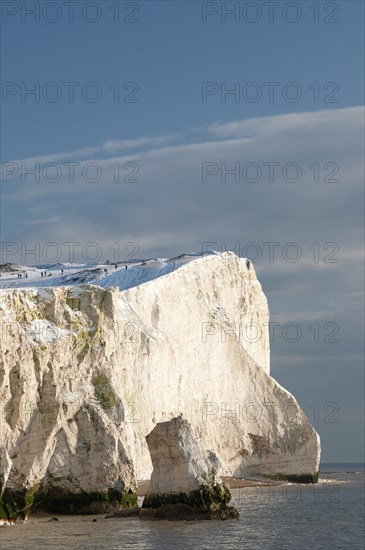 England, East Sussex, Seaford Head, Snow on cliffs with people toboganing. Photo : Bob Battersby