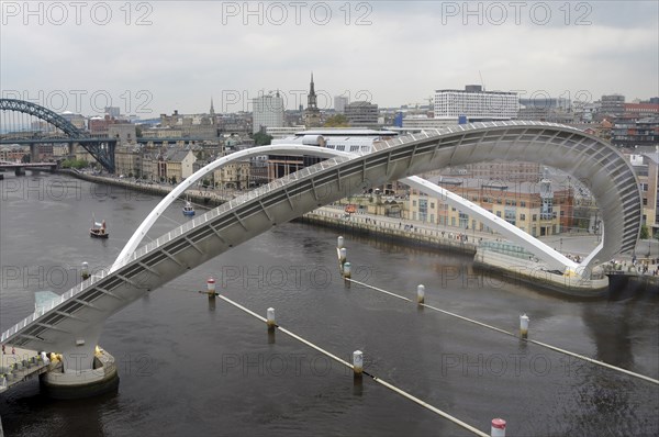 England, Tyneside, Gateshead, Millennium Bridge in open position from the Baltic Arts Centre looking towards Newcastle Quayside and Newcastle upon Tyne city. Photo : Bob Battersby