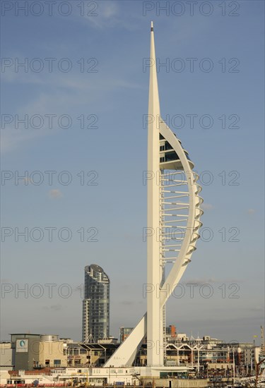 England, Hampshire, Portsmouth, Spinnaker Tower and Gunwharf Quay shopping center seen from the harbour. Photo : Bob Battersby