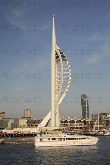 England, Hampshire, Portsmouth, Spinnaker Tower and Gunwharf Quay shopping center seen from the harbour. Photo : Bob Battersby