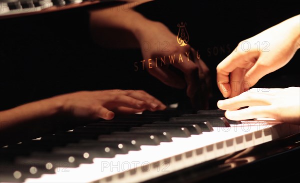 Music, Instruments, Keyboards, Piano Close of of musicians hands playing Steinway. Photo : Sean Aidan