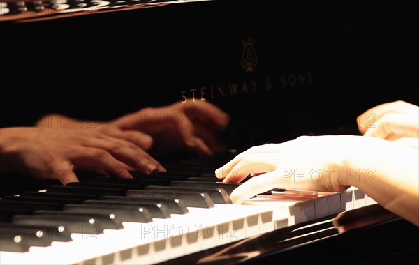Music, Instruments, Keyboards, Piano Close of of musicians hands playing Steinway. Photo : Sean Aidan