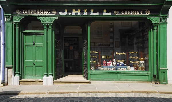 Ireland, County Tyrone, Omagh, Ulster American Folk Park 19th century street Hills chemist shopfront. Photo : Hugh Rooney