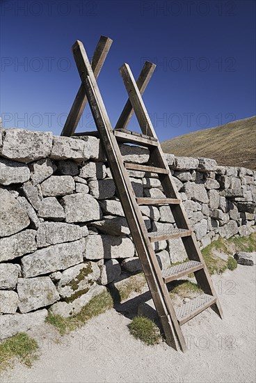 Ireland, County Down, Mourne Mountains, Typical stile over Mourne wall on Slieve Donard. Photo : Hugh Rooney