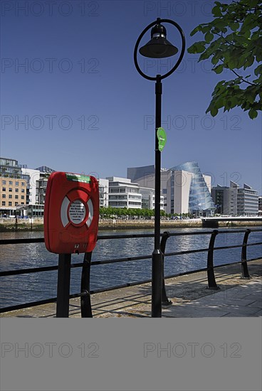 Ireland, County Dublin, Dublin City, River Liffey with the Convention Centre streetlamp and lifebuoy in foreground. Photo : Hugh Rooney