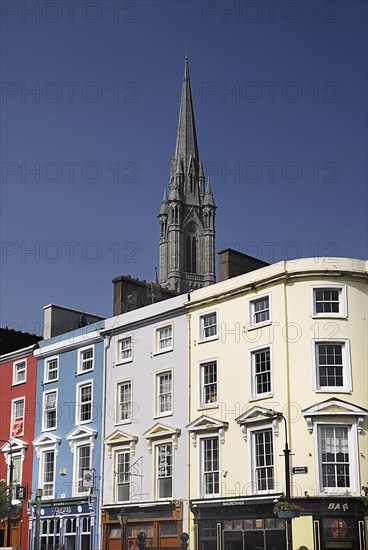 Ireland, County Cork, Cobh, St Colmans Cathedral overlooking colourful houses. Photo : Hugh Rooney