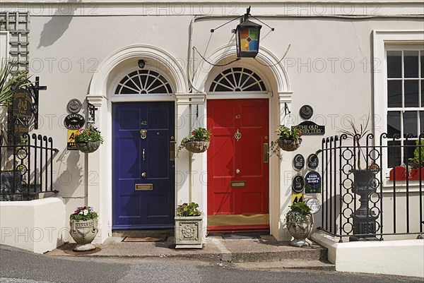 Ireland, County Cork, Kinsale, Colourful doorways of terraced houses. Photo : Hugh Rooney