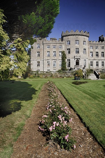 Ireland, County Sligo, Markree, Castle hotel view of a section of the castle with row of flowers in the foreground. Photo : Hugh Rooney