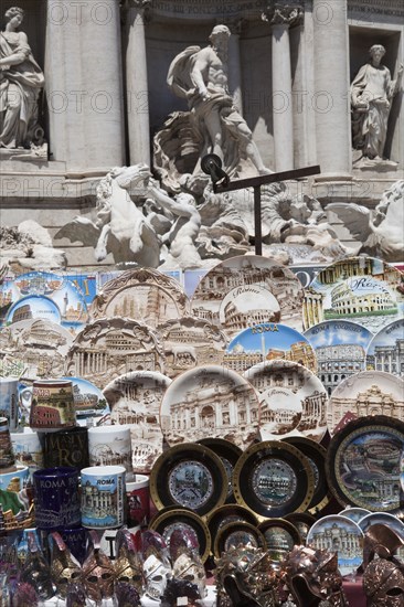 Italy, Lazio, Rome, Display of tourist souvenir gifts beside the baroque Trevi Fountain by Nicola Salvi 1762 against the Palazzo Poli. Photo : Bennett Dean