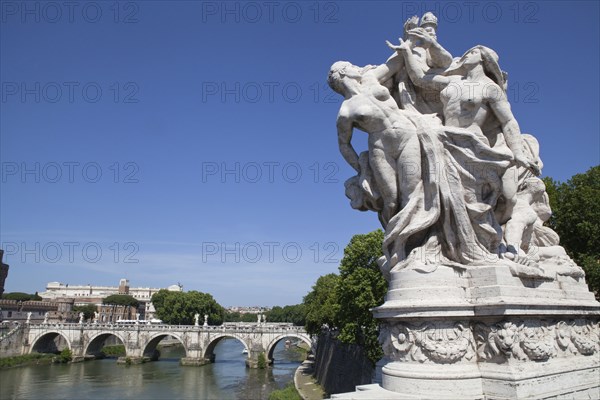 Italy, Lazio, Rome, Statue on the Ponte Vittorio Emanuele with Castel Sant Angelo in the background. Photo : Bennett Dean