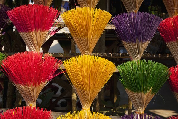 Vietnam, Thuy Zuan Hat village, Colourful bundles of incense sticks for sale. Photo : Mel Longhurst