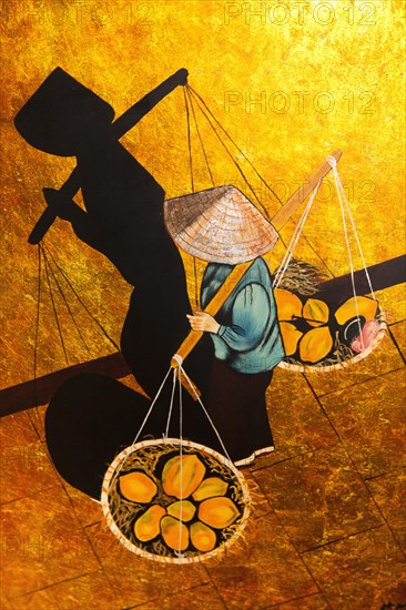 Vietnam, Tourist Goods, Painting of Vietnamese woman carrying goods in baskets on pole across her shoulders. Photo : Mel Longhurst