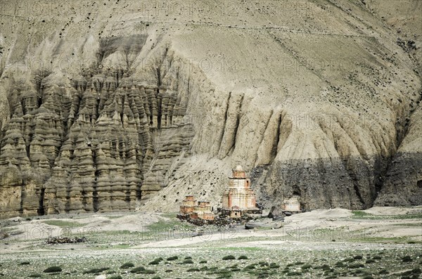 Nepal, Upper Mustang, Dhakmar, Distant Gompas and eroded rocks near Dhakmar village. Photo : Sergey Orlov