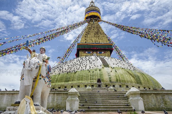Nepal, Kathmandu, Boudhanath Stupa Five-color prayer flags and symbolic sculptures with mantras. Photo : Sergey Orlov