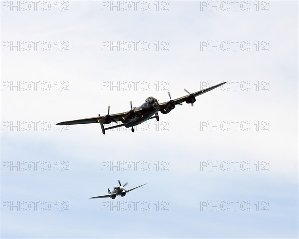 England, East Sussex, Beachy Head, Lancaster Bomber and Spitfire taking part in the Airbourne air show. Photo : Bob Battersby