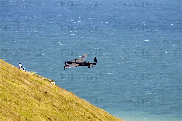 England, East Sussex, Beachy Head, Lancaster bomber taking part in the Airbourne air show. Photo : Bob Battersby