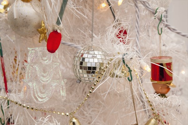 Festivals, Religious, Christmas, Detail of tree decorated with lights tinsel and various baubles. Photo : Stephen Rafferty