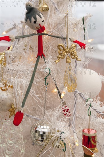 Festivals, Religious, Christmas, Detail of tree decorated with lights tinsel and various baubles. Photo : Stephen Rafferty