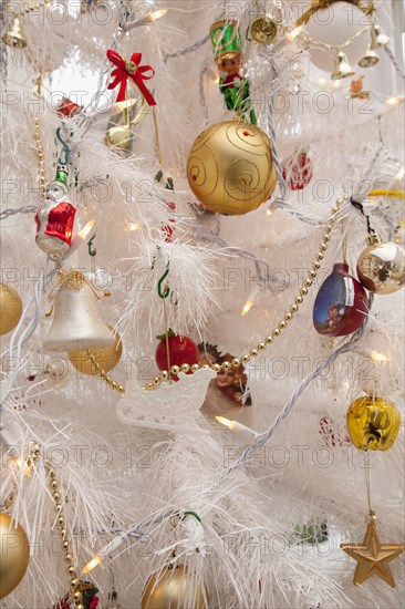 Festivals, Religious, Christmas, Detail of tree decorated with lights tinsel and various baubles. Photo : Stephen Rafferty