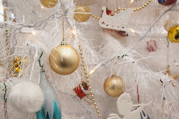 Festivals, Religious, Christmas, Detail of tree decorated with lights tinsel and various baubles. Photo : Stephen Rafferty