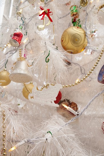 Festivals, Religious, Christmas, Detail of tree decorated with lights tinsel and various baubles. Photo : Stephen Rafferty