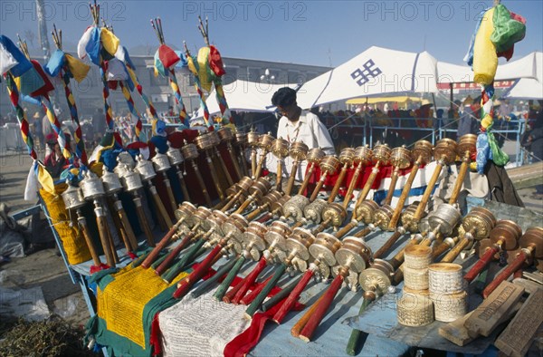 Tibet, Lhasa, Barhor Square, Display of Prayer wheels and flags for sale at a market. 
Photo Bennett Dean / Eye Ubiquitous