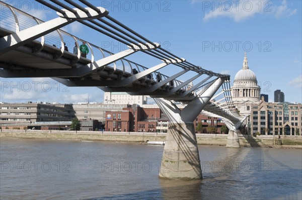 The Millennium bridge spans the river Thames between the Tate Modern art gallery and Sir Christopher Wren's St Paul's cathedral in the city of London