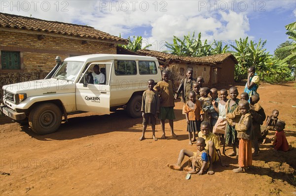 Rwanda, Children, Group of children on road beside a development project vehicle. 
Photo Nic I Anson / Eye Ubiquitous