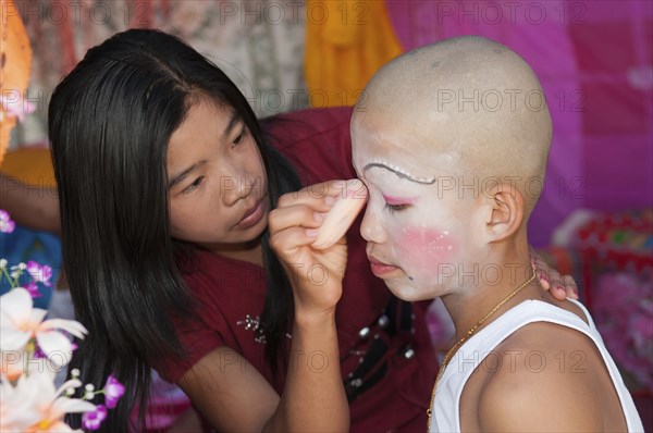 Thailand, Chiang Mai, Poi Sang Long is the ordination ceremony for Shan boys to become novice Buddhist monks in Thailand. It is expected that every male will ordain as a monk at least once in his life. The entire ceremony last 3-4 days and relates directly to the life story of the Buddha who was once a prince in northern India and rejected his privileged royal lifestyle in favour of a humble existence seeking only inner enlightenment. After their heads are shaved the boys become crystal sons dressed only in white. This is followed by a period of 3 days when they dress elaborately and lavishly like the princes of old India. During that time they are pandered and catered to in the style of a prince. They are even carried about on the shoulders of family or friends so that their feet do not touch the ground. 
Photo Martin F. Johnston / Eye Ubiquitous