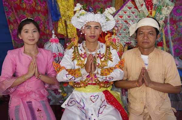 Thailand, Chiang Mai, Poi Sang Long is the ordination ceremony for Shan boys to become novice Buddhist monks in Thailand. It is expected that every male will ordain as a monk at least once in his life. The entire ceremony last 3-4 days and relates directly to the life story of the Buddha who was once a prince in northern India and rejected his privileged royal lifestyle in favour of a humble existence seeking only inner enlightenment. After their heads are shaved the boys become crystal sons dressed only in white. This is followed by a period of 3 days when they dress elaborately and lavishly like the princes of old India. During that time they are pandered and catered to in the style of a prince. They are even carried about on the shoulders of family or friends so that their feet do not touch the ground. 
Photo Martin F. Johnston / Eye Ubiquitous